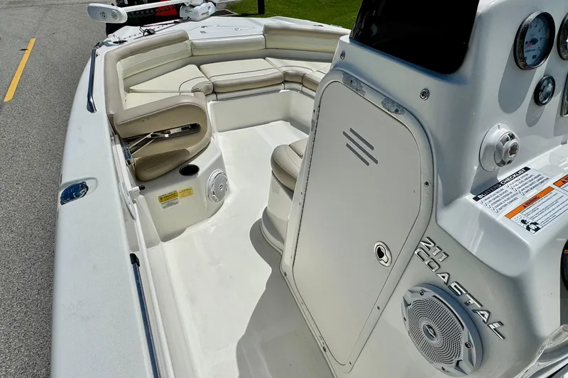 Slide: The Image of 2017 NauticStar 211 Coastal boat interior with seating and control panel. - 11