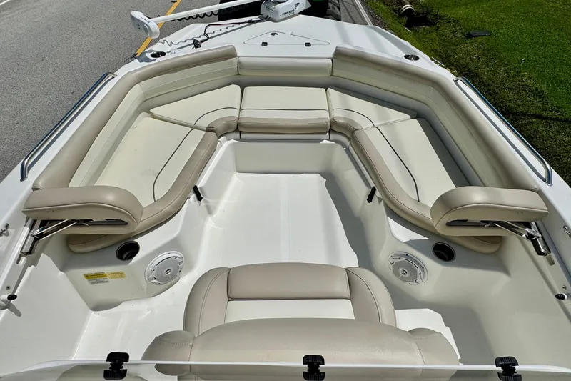 Slide: The Image of 2017 NauticStar 211 Coastal boat interior with beige seating and spacious layout. - 13