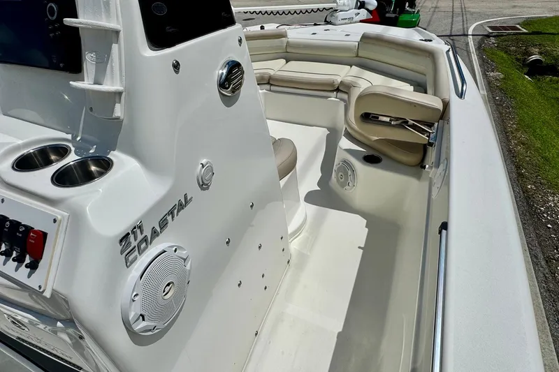 Slide: The Image of 2017 NauticStar 211 Coastal boat interior with seating and control panel. - 14