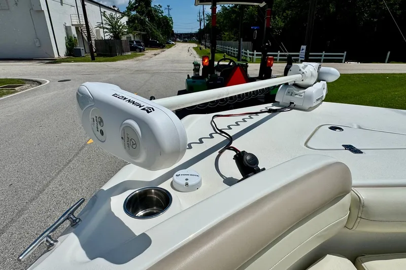 Slide: The Image of 2017 NauticStar 211 Coastal boat with Minn Kota trolling motor on deck. - 17