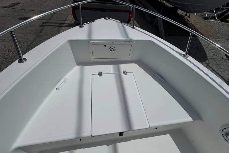 Slide: The Image of 2010 Century 1801 Center Console boat deck with storage compartments and railing. - 11