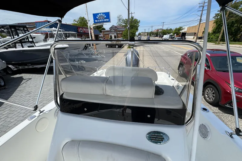 Slide: The Image of 2010 Century 1801 Center Console boat on display at a dealership. - 13