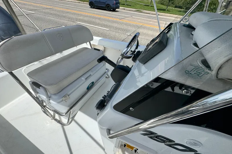 Slide: The Image of 2010 Century 1801 Center Console boat interior with steering wheel and seating. - 15