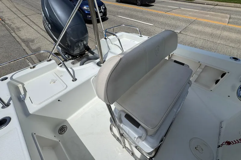 Slide: The Image of 2010 Century 1801 Center Console boat with Yamaha engine on a road. - 16