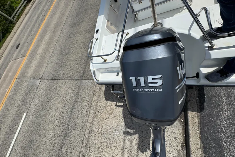 Slide: The Image of Century 1801 Center Console 2010 with Yamaha 115 four-stroke engine on a trailer. - 19