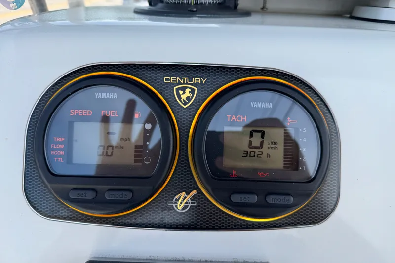 Slide: The Image of Dashboard of a 2010 Century 1801 Center Console boat with Yamaha gauges. - 2