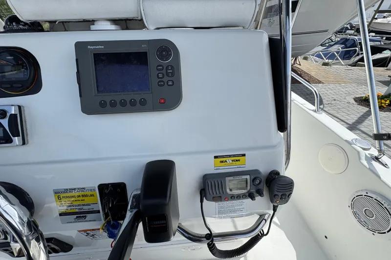 Slide: The Image of Century 1801 Center Console 2010 boat dashboard with navigation and communication equipment. - 5