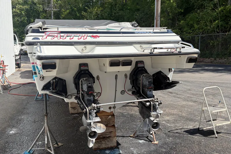 Slide: The Image of 1991 Formula 311 SR-1 boat on stands, rear view with dual propellers. - 4