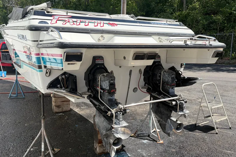 Slide: The Image of Rear view of a 1991 Formula 311 SR-1 boat with dual outboard motors. - 5
