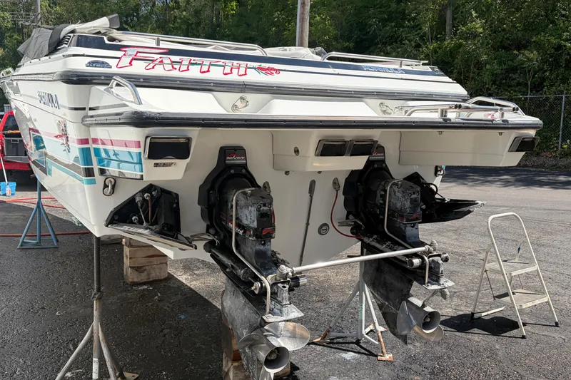 Slide: The Image of 1991 Formula 311 SR-1 boat with dual outboard motors on a trailer. - 6