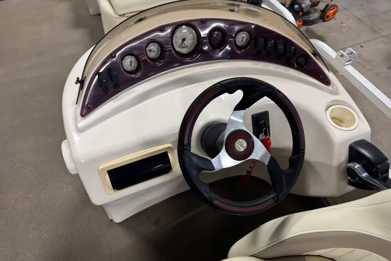 Slide: The Image of Dashboard of a 2008 Bennington 2075GSi boat with steering wheel and gauges. - 10