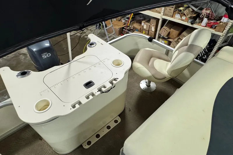 Slide: The Image of 2008 Bennington 2075GSi boat interior with captain's chair and Yamaha 50 engine. - 13