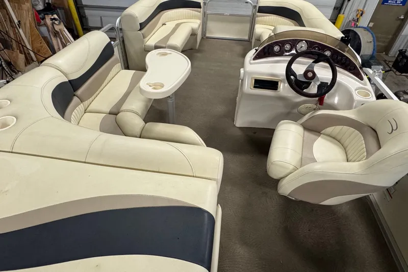 Slide: The Image of Interior of a 2008 Bennington 2075GSi pontoon boat with beige seating and steering console. - 14