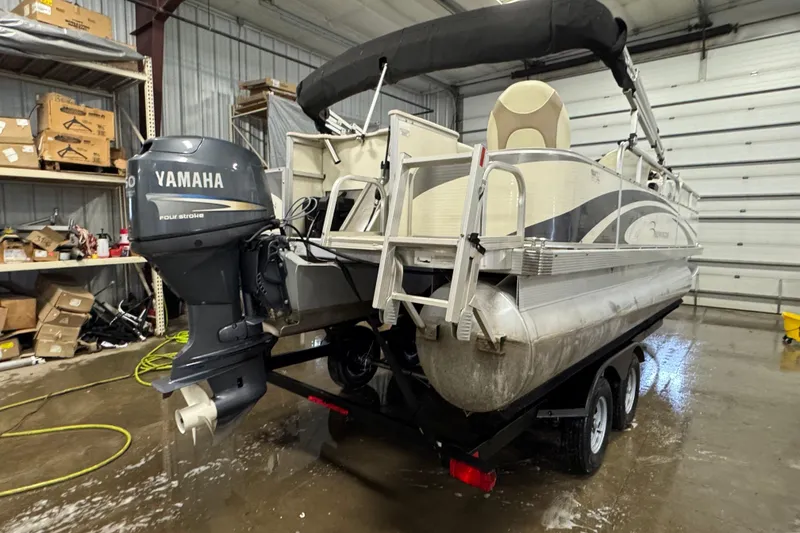 Slide: The Image of 2008 Bennington 2075GSi pontoon boat with Yamaha outboard motor in a garage setting. - 3