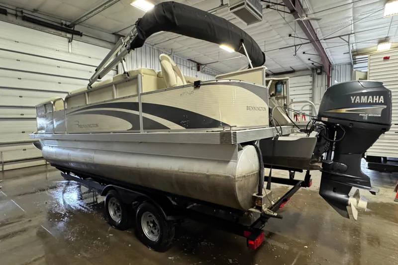 Slide: The Image of 2008 Bennington 2075GSi pontoon boat with Yamaha outboard motor in a garage setting. - 4