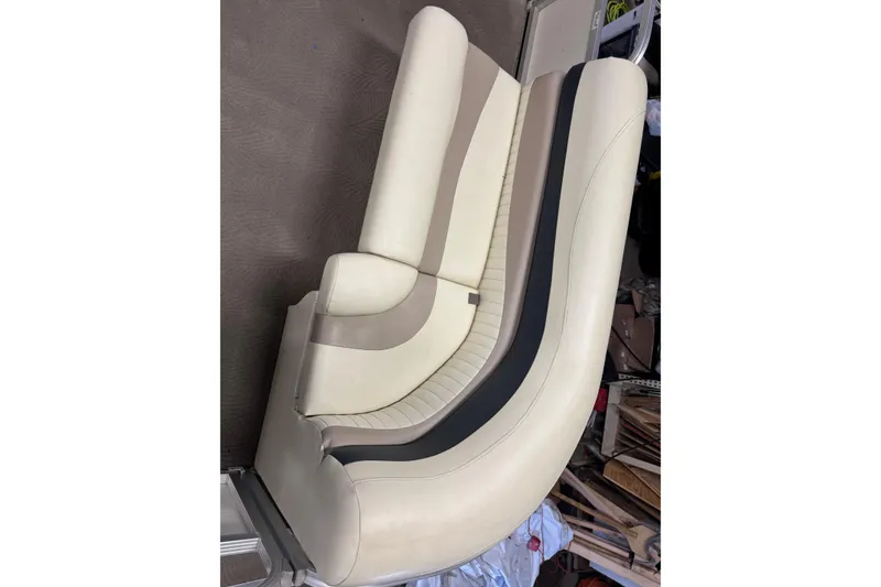 Slide: The Image of Cream and beige boat seat from a 2008 Bennington 2075GSi, featuring sleek design. - 5