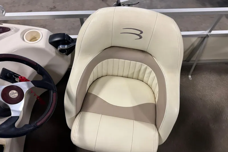 Slide: The Image of Captain's chair and steering wheel of a 2008 Bennington 2075GSi boat. - 9