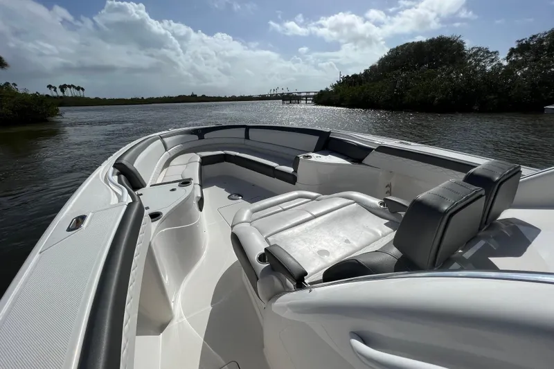 Slide: The Image of 2021 Fountain 39 NX boat interior with sleek seating on a sunny day. - 35