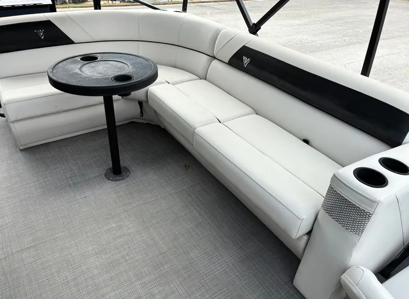 Slide: The Image of Interior of a 2022 Misty Harbor DM20F pontoon boat with seating area. - 13