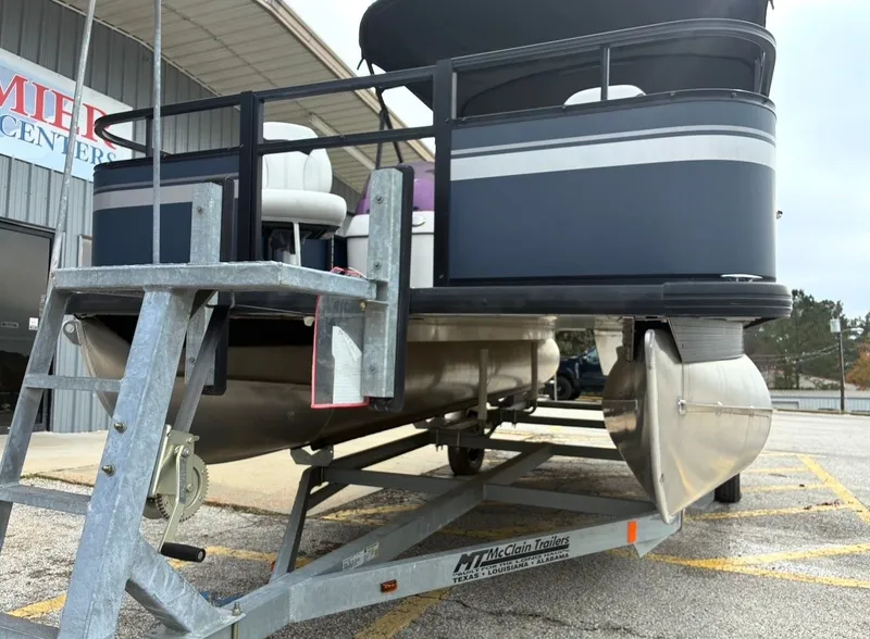 Slide: The Image of 2022 Misty Harbor DM20F pontoon boat parked on trailer. - 6