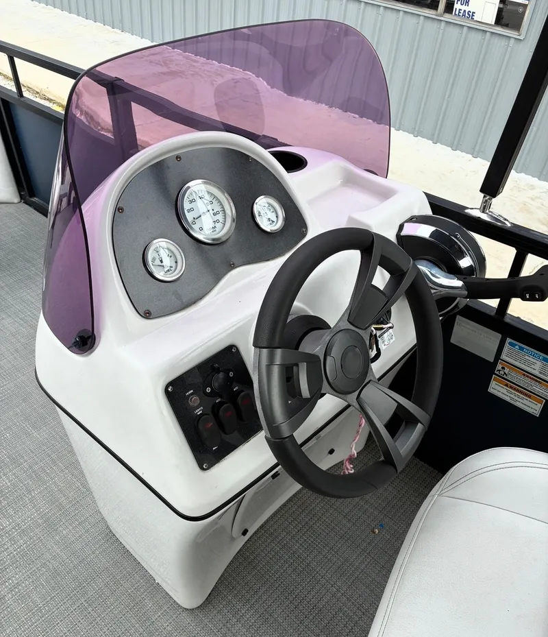 Slide: The Image of Steering console of a 2022 Misty Harbor DM20F pontoon boat. - 7