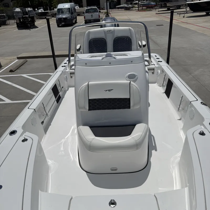 Slide: The Image of 2026 Tidewater 2110 Bay Max boat parked at marina. - 16