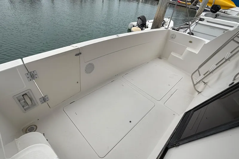 Slide: The Image of 1996 Bayliner 3988 Command Bridge Motoryacht deck, featuring spacious layout and clean design. - 19