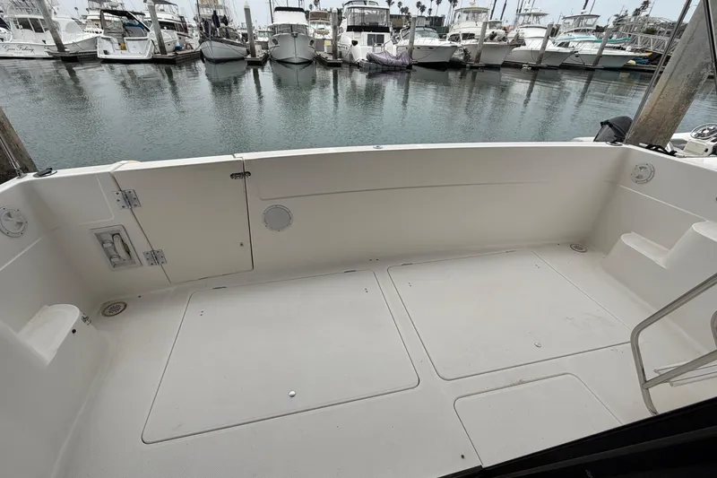 Slide: The Image of 1996 Bayliner 3988 Command Bridge Motoryacht cockpit with marina view. - 20