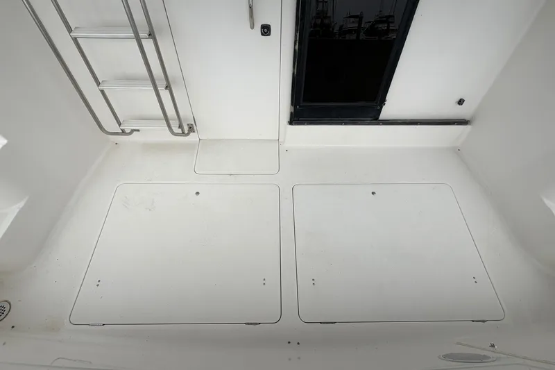 Slide: The Image of 1996 Bayliner 3988 Command Bridge Motoryacht deck with ladder and hatch covers. - 21