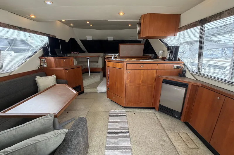 Slide: The Image of Interior of 1996 Bayliner 3988 Command Bridge Motoryacht with modern kitchen and seating area. - 23