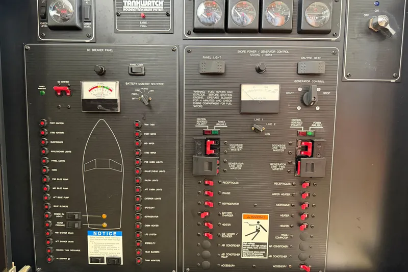 Slide: The Image of Control panel of a 1996 Bayliner 3988 Command Bridge Motoryacht with various switches and gauges. - 27
