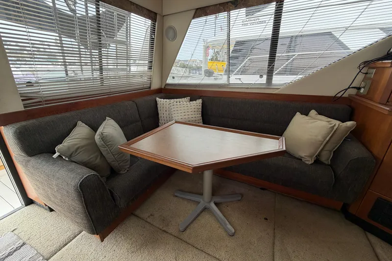 Slide: The Image of Interior of 1996 Bayliner 3988 Command Bridge Motoryacht with cozy seating and table. - 28