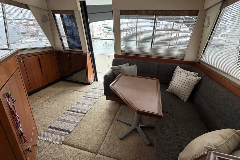 Slide: The Image of Interior of 1996 Bayliner 3988 Command Bridge Motoryacht with seating and table. - 29