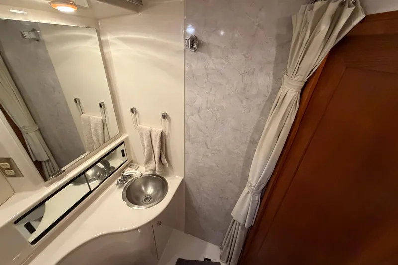 Slide: The Image of Bathroom interior of 1996 Bayliner 3988 Command Bridge Motoryacht with sink and mirror. - 44