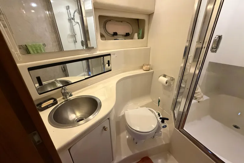 Slide: The Image of Bathroom interior of 1996 Bayliner 3988 Command Bridge Motoryacht, featuring sink and shower. - 46