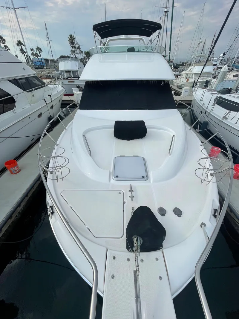 Slide: The Image of 1996 Bayliner 3988 Command Bridge Motoryacht docked in marina. - 6