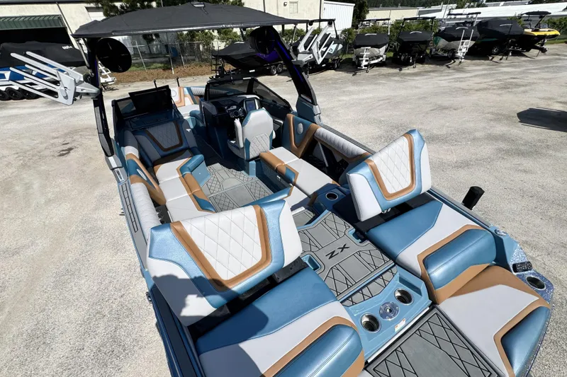 Slide: The Image of 2021 Tigé 23ZX boat interior with luxurious seating and modern design. - 12