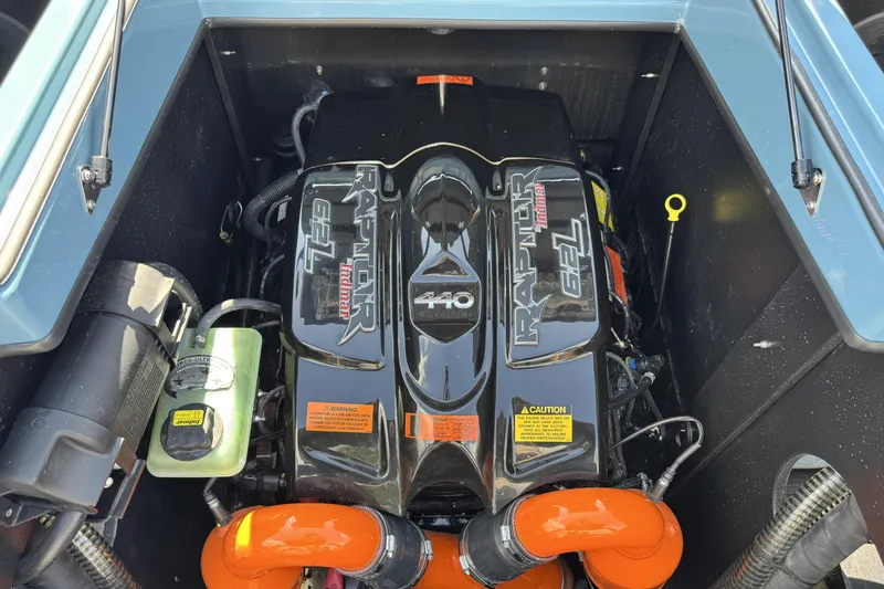 Slide: The Image of Engine compartment of 2021 Tigé 23ZX boat featuring a Raptor 6.2L motor. - 13