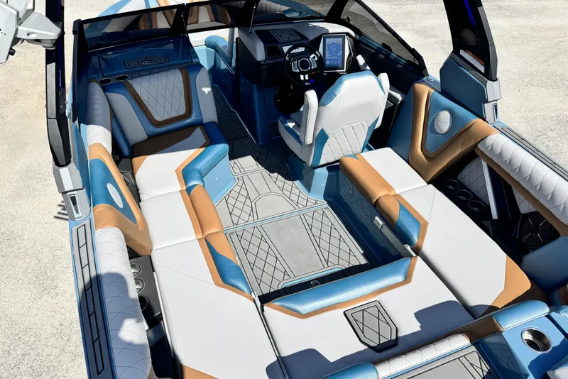 Slide: The Image of 2021 Tigé 23ZX boat interior with luxurious seating and modern dashboard design. - 6