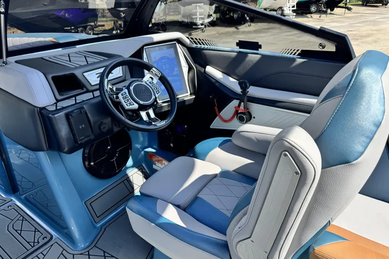 Slide: The Image of 2021 Tigé 23ZX boat interior with modern dashboard and steering wheel. - 7
