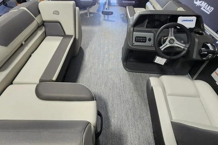 Slide: The Image of Interior view of 2026 Sun Tracker Fishin' Barge 20 DLX with seating and steering console. - 3