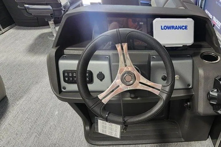Slide: The Image of Steering console of 2026 Sun Tracker Fishin' Barge 20 DLX with Lowrance display. - 5