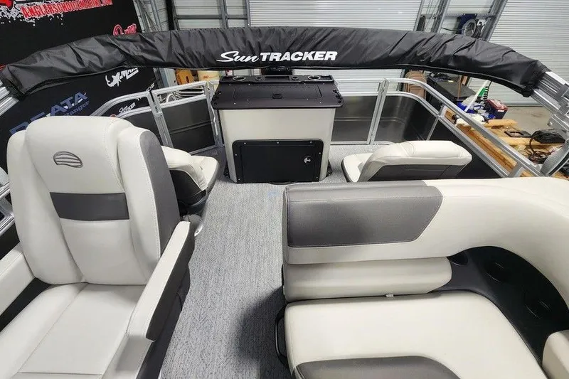 Slide: The Image of Interior view of 2026 Sun Tracker Fishin' Barge 20 DLX pontoon boat with seating. - 7