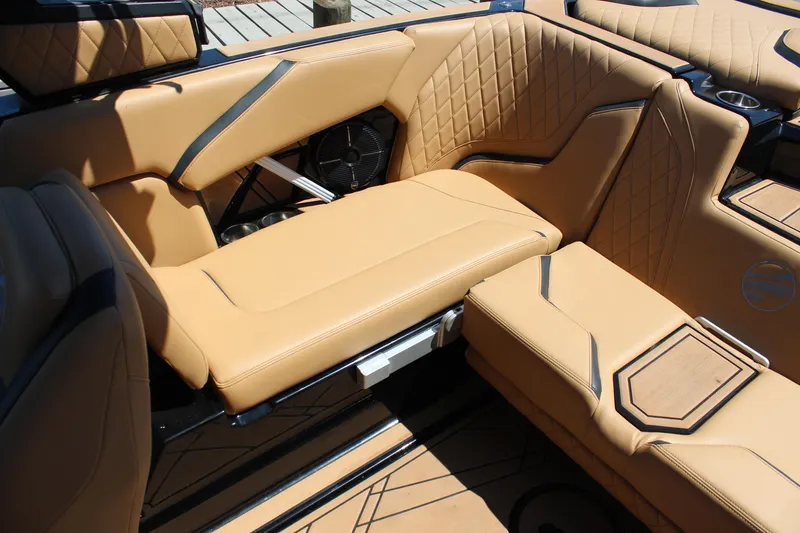 Slide: The Image of Luxurious interior of 2022 Tigé 22RZX boat with tan leather seating and stylish design. - 16