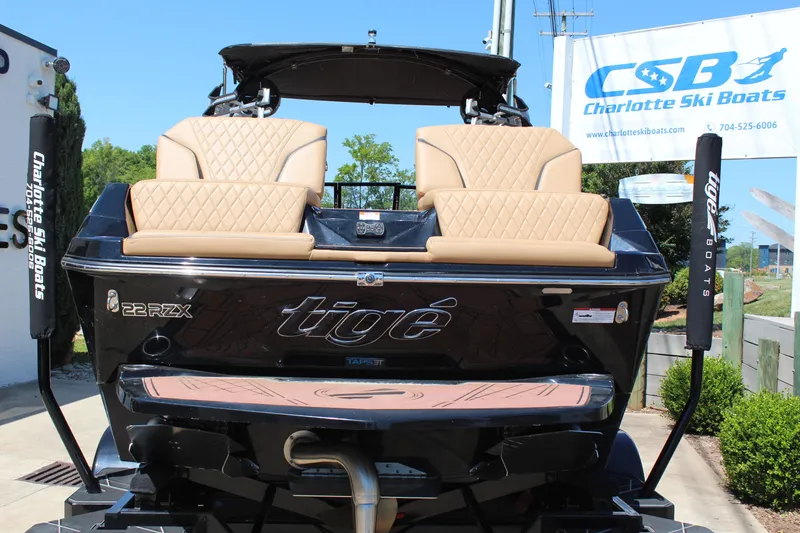 Slide: The Image of 2022 Tigé 22RZX boat with tan seating at Charlotte Ski Boats dealership. - 5