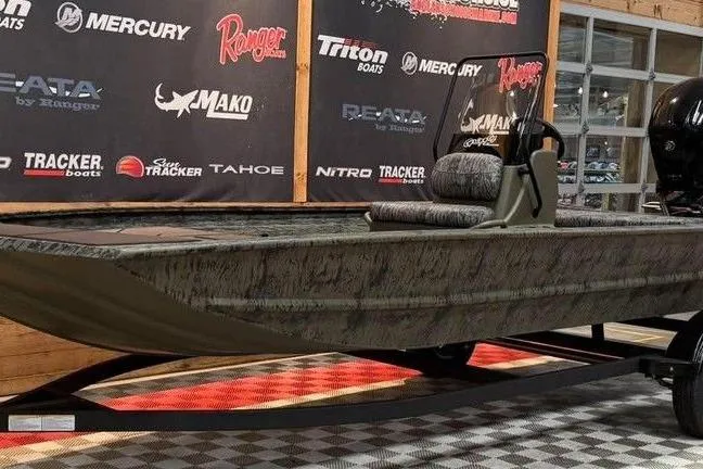 Slide: The Image of 2017 Tracker Pro Team 175 TXW fishing boat on display indoors. - 10