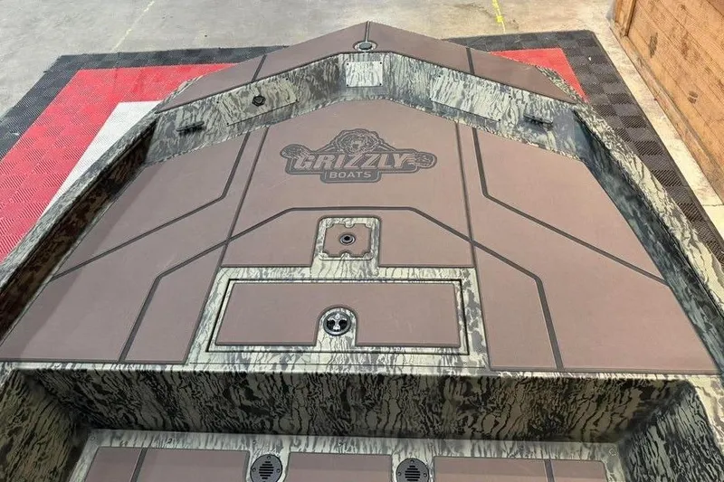 Slide: The Image of 2017 Tracker Pro Team 175 TXW boat deck with Grizzly Boats logo, camo design. - 8