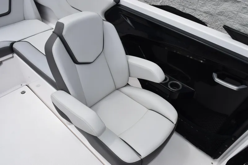 Slide: The Image of 2023 Yamaha Boats AR250 interior seat with sleek design and cup holders. - 10
