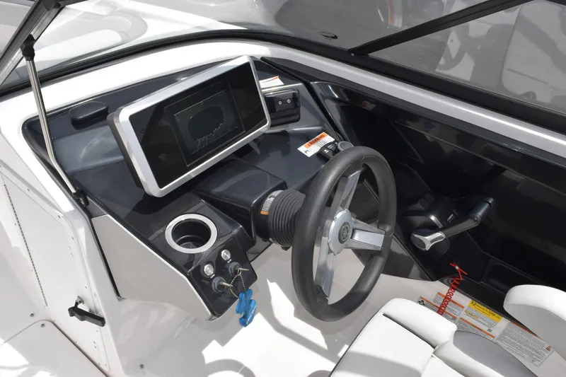 Slide: The Image of 2023 Yamaha AR250 boat dashboard with steering wheel and digital display. - 12