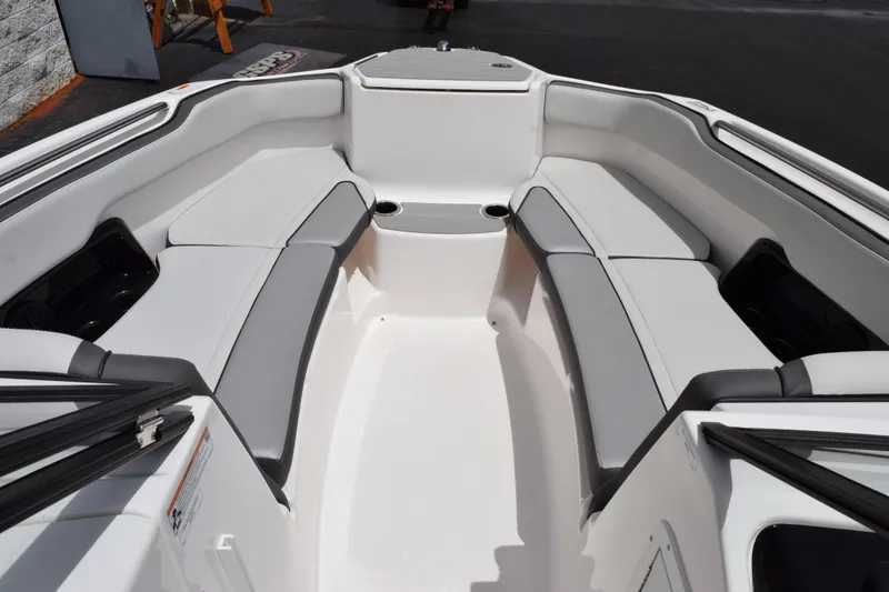 Slide: The Image of 2023 Yamaha Boats AR250 interior with spacious seating and modern design. - 14